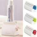 【FUN LIVE】 1Pc Rolling Tube Toothpaste Squeezer Dispenser Stand Holder For Bathroom Plastic Cream Tube Squeezing Dispenser ( Random Color ) By JUST4U. 