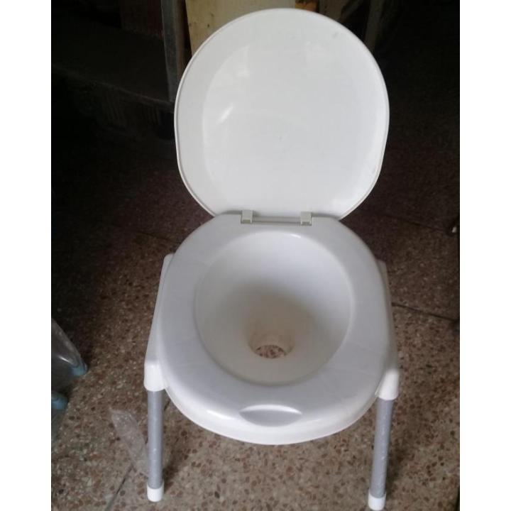 Plastic Material Over The Flush Usage Commode Seat With Four Strong Steel Legs