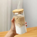 Square Glass - Square shape Glass with glass straw and wooden lid -Premium Transparent Square Drinking Glass Tumbler with Bamboo Lid And Glass Straw - Household kitchen accessories. 