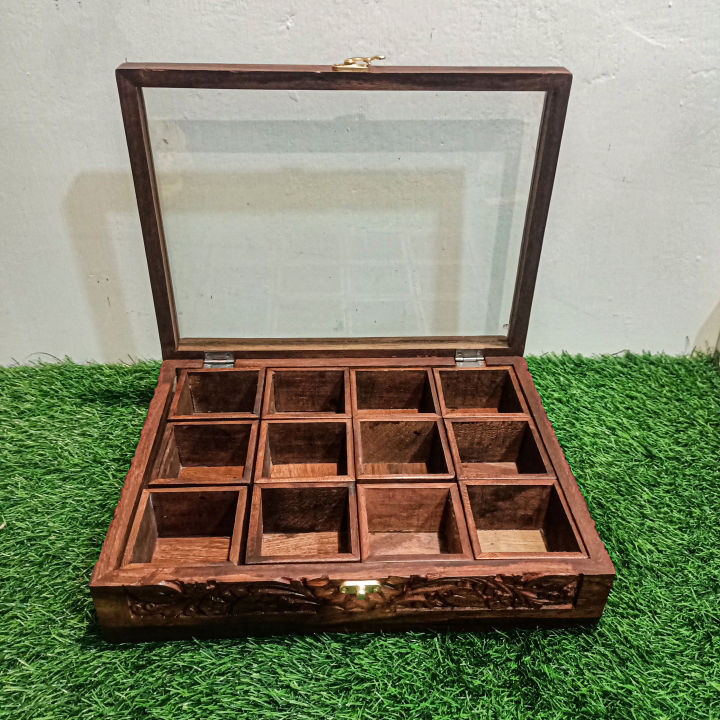 Spice%20Container%20(%20Masala%20Box%20)%20Made%20of%20Pure%20Rose%20Wood%20with%20Hand%20Carving%20Having%2012%20removable%20boxes%20with%20capacity%20of%20over%20100%20Gram%20(Powder%20Spices)%C2%A0with%C2%A0Glass%C2%A0Lid%20and%20one%20Spoon%20-%20Image%203
