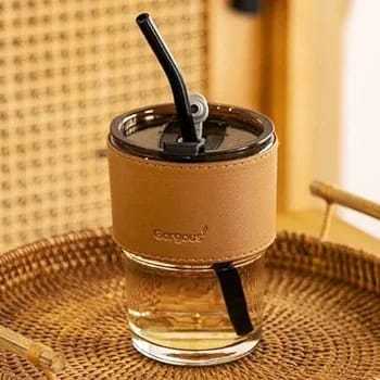 Tumbler%20Mug%20with%20Lid,%20Glass%20Straw%20and%20Protective%20Anti-Skid%20Leather%20Sleeve%20for%20Hot%20and%20Cold%20Beverages%20Tea%20Coffee%20Smoothies%20Fruit%20Juice%20Travel%20Mug%20.435ml%20-%20Image%202