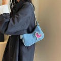 denim Shoulder bag Trendy blue Crescent moon bag Denim underarm bag for Evening events Night out Fashion shows Celebrities Fashion enthusiasts. 