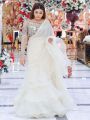 Madiha Ahsan wearing Organza Ruffle Saree paired with a fancy blouse [Stitched]. 