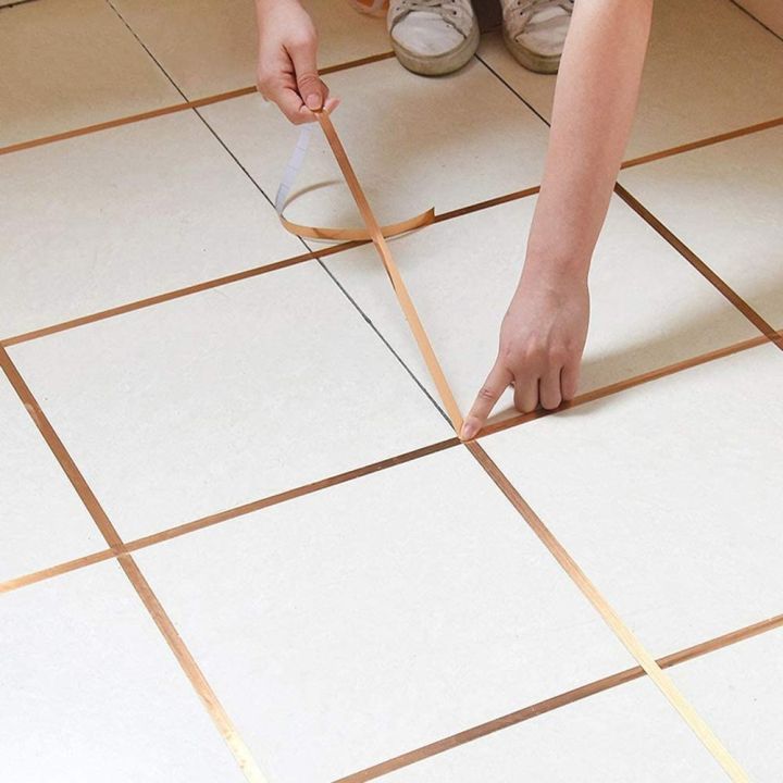 Tile%20Gap%20Filler%20Tape%20in%20Gold:%20Easy%20Peel-and-Stick%20Solution%20for%20Perfect%20Finishes%20Home%20Decor%20%E2%80%93%20Peel%20and%20Stick%20Design%20for%20Easy%20Wall%20Transformations%20,%20Home%20decor%20gold%20strip%20-%20Image%202
