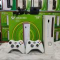 Xbox 360 with 2 Wireless Controllers || 1TB Hard Disk 200 Games installed with handfree free gift. 