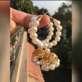 Elegant White Bead Jhumki Earring: Exquisite and Stylish Trendsetter. 