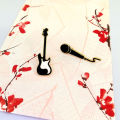 European and American simple fashion creative cute rock guitar microphone metal brooch badge male pin bag accessories women. 