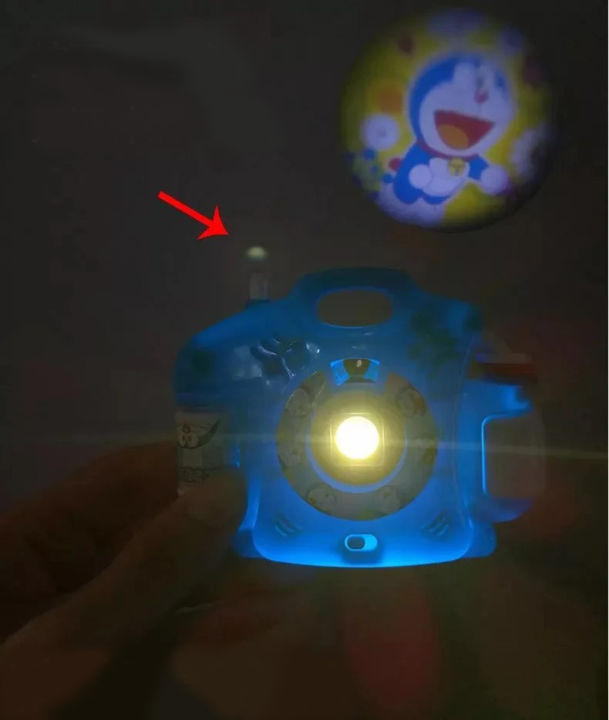 Kids%20Mini%20Doraemon%20Projector%20Camera%20Toy%20For%20Kids/%20Kids%20Cell%20Operated%20LED%20Mini%20Image%20Projector%20Camera%20Easily%20Switch%20Image%20By%20Pressing%20Button/%20LED%20Projector%20Light%20With%2024%20Animal%20Images%20Pattern%20With%203%20Random%20Chips%20Easy%20To%20Carry%20Amazing%20FOR%20bedtime%20Story%20-%20Image%206