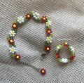 Small beaded bracelet in flower petal design. 