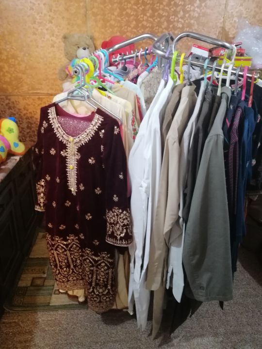 Rotating%20Boutique%20Display%20Stand%20Metal%20Clothes%20Rack%20for%20Hanging%20Shirts,%20Dresses,%20and%20Coats%20Ideal%20for%20Fashion%20Stores,%20Exhibitions,%20and%20Retail%20Outlets.%20-%20Image%203