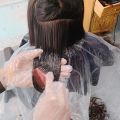 Disposable cape and glove set for hair dye and colour. 