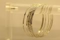 Silver metal bangles for girls Silver metal bangles for women, pack of 12 silver metal bangles for ladies available sizes are 2", 2.25", 2.50". 