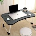 Black wooden foldable laptop table. 