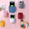Mobile charging stand remote holder self adhesive wall mounted Mobile phone charging stand. 