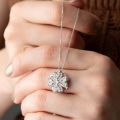 Elegant Floral Pendant Necklace with Cubic Zirconia Accents in Silver Tone. 