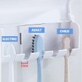 Plastic Set of Toothpaste Dispenser & Toothbrush Holder - White Automatic Tooth paste Dispenser and Tooth brush Holder Set  Wall Mounted Toothpaste Dispenser with 5 Toothbrush Holder Set  Toothpaste Squeezing Machine  Tooth brush Holder. 