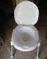 Plastic Material Over The Flush Usage Commode Seat With Four Strong Steel Legs. 
