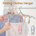 Travel Portable Creative Plastic Hanger Multifunctional Simple Folding Non-slip Clothes Rack with Clips Household Space Saving Storage Tools. 