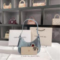denim Shoulder bag Trendy blue Crescent moon bag Denim underarm bag for Evening events Night out Fashion shows Celebrities Fashion enthusiasts. 