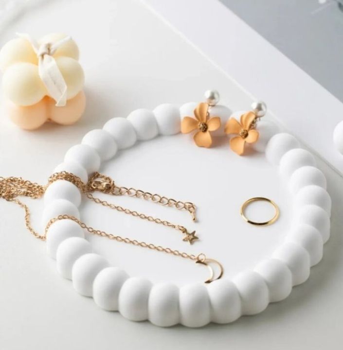 Introducing%20the%20Jesmonite%20Bubble%20Tray,%20a%20versatile%20item%20that%20functions%20as%20a%20stylish%20tray,%20jewelry%20trinket%20dish,%20and%20minimalist%20home%20decor.%20Crafted%20from%20Jesmonite%20stoneware,%20this%20decorative%20tray%20brings%20a%20modern%20touch%20to%20any%20space.%20Its%20distinctive%20bubble%20de%20-%20Image%202