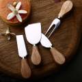 Set Of 4- Cheese Knives with Bamboo Wood Handle- Stainless Steel Cheese Spreader Cutter Knives -  Cheese Slicer and Butter Cutter-  Cheese Knife Set for Cheese serving.. 