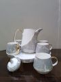 9  Pcs Premium Quality  Ceramic Grey-White-Gold Rotating Tea Set (Random Print). 