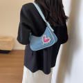 denim Shoulder bag Trendy blue Crescent moon bag Denim underarm bag for Evening events Night out Fashion shows Celebrities Fashion enthusiasts. 