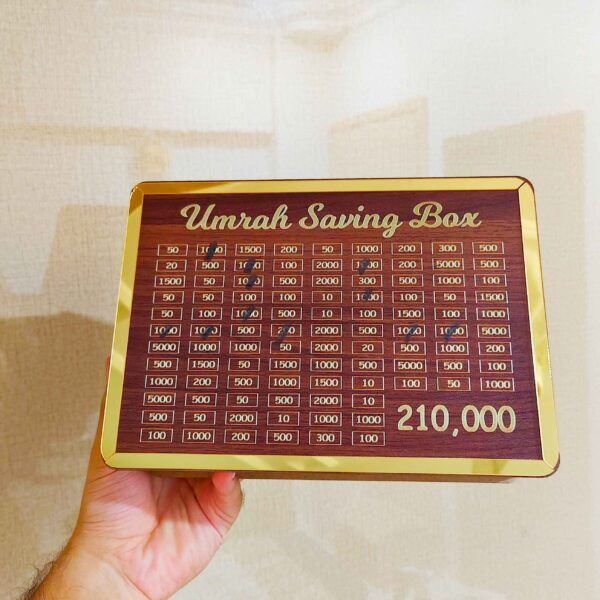 New%20Wooden%20Umrah%20Saving%20Jar%20with%20280-Day%20Target%20System%20%E2%80%93%20Beautiful%20Islamic%20Design%20Featuring%20Makkah%20&%20Madinah%20%E2%80%93%20Daily%20Coin%20Deposit%20Idea%20for%20Long-Term%20Pilgrimage%20Planning%20%E2%80%93%20Suitable%20for%20Eid,%20Nikah%20&%20Ramadan%20Gifting%20-%20Image%202