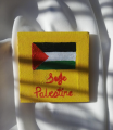 Palestine crochet keychain and painted canvas. 