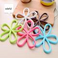Safdar Mart- 1 Pc Kitchen Table Mat Anti Slip Silicone Plum Blossom Shape Dining Table Pot Pad Heat Proof Heat Insulation Placemat (Multicolor). 