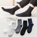 Socks wholesale spring summer men's cotton socks casual mid socks black and white business solid color thin men's socks manufacturers wholesale. 