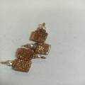 Golden colour square shape glitter stone size is 14/14 for sale in very reasonable price.. 