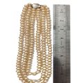 Vintage Faux 3 Stand Pearl Necklace | The necklace boasts a classic vintage design. 