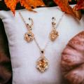 Beautiful Golden Crystal Pendent with Ear rings for girls and Women , beautiful and stylish design, Golden Mattel with beautiful Crystal. 