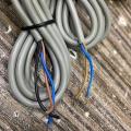 E3F-5DN1 series cylinder amplifier photoelectric sensor. 
