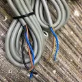 E3F-5DN1 series cylinder amplifier photoelectric sensor. 