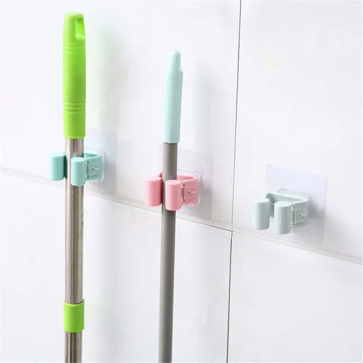 Wall%20Mounted%20Mop%20&%20Broom%20Holder%20%E2%80%93%20Self-Adhesive,%20Waterproof%20Multi-Tool%20Organizer%20Rack%20with%20Hooks%20%E2%80%93%20No%20Drill,%20Space-Saving%20Storage%20Solution%20for%20Kitchen%20&%20Bathroom%20Cleaning%20Tools%20-%20Image%203