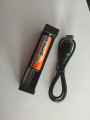 TG06S flashlight with battery and charging slot. 