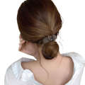 Simple solid color for women with design hair clip at back of the head featuring trendy internet celebrity bun hairstyle and a high ponytail accessory.