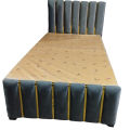 Modern single bed made with wood, furniture factory. 