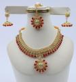 Golden Designer Jewellery Set with Red Stone. 