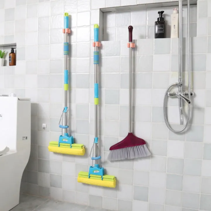 Wall%20Mounted%20Mop%20&%20Broom%20Holder%20%E2%80%93%20Self-Adhesive,%20Waterproof%20Multi-Tool%20Organizer%20Rack%20with%20Hooks%20%E2%80%93%20No%20Drill,%20Space-Saving%20Storage%20Solution%20for%20Kitchen%20&%20Bathroom%20Cleaning%20Tools%20-%20Image%208
