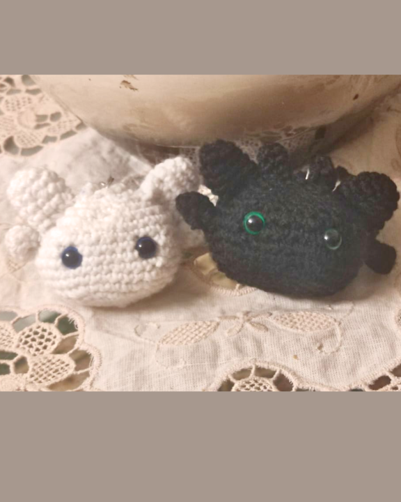 Keychains of Light Fury and Toothless