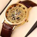 Golden Skeleton Quartz Movement Transparent Back Watch (New). 