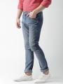 The-Ajmery Medium Blue Ripped Denim Jeans For Men. 