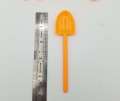 PLASTIC SHOVEL SPOONS IN ORANGE COLOR ( PACK OF 20 SPOONS ). 