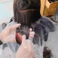 Disposable cape and glove set for hair dye and colour. 