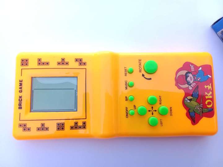 Childhood%20Classic%20Fun%20Tetris%20Hand%20Held%20Electronic%20Game%20Toys%20Brick%20Game%20NEW%20%7C%20Kids%20Electronic%20Tetris%20Game%20Handheld%20Game%20Machine%20LCD%20Educational%20Toys%20%7C%20Kids%20Super%209999%20in%201%20Multi%20Color%20(Cell%20Operated)%20-%20Image%202