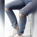 The-Ajmery Medium Blue Ripped Denim Jeans For Men. 