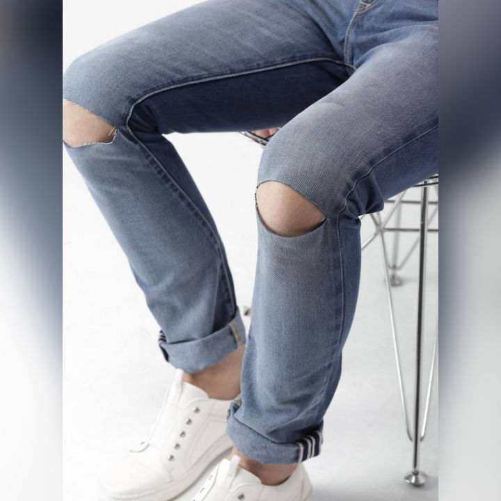 The-Ajmery Medium Blue Ripped Denim Jeans For Men